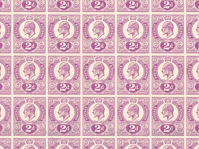 A closeup of a sheet of purple stamps.